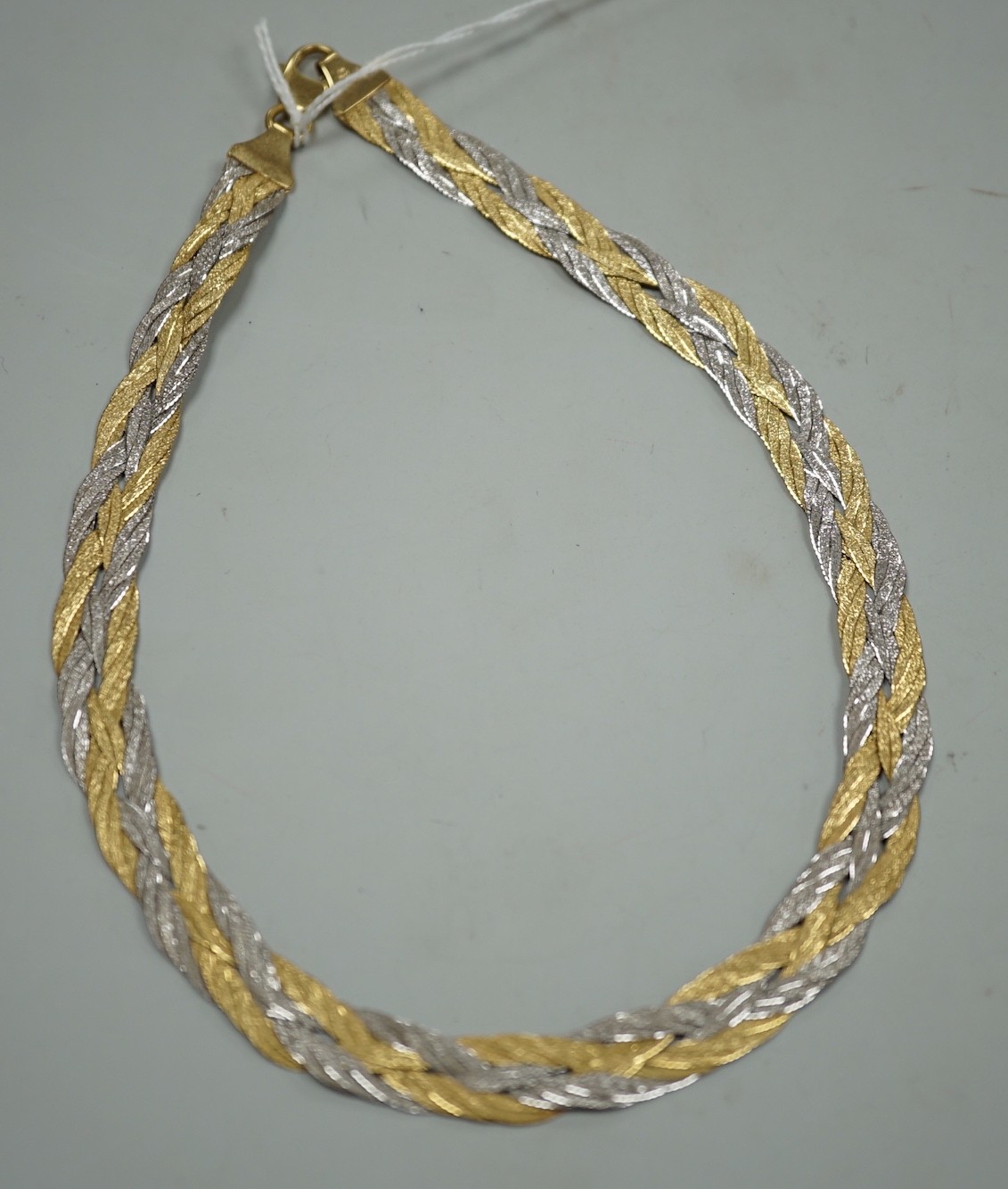 A modern Italian two colour 750 interwoven necklace, 38cm, 33.8 grams.